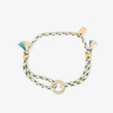 Colorful braided bracelet with gold accents on a white background