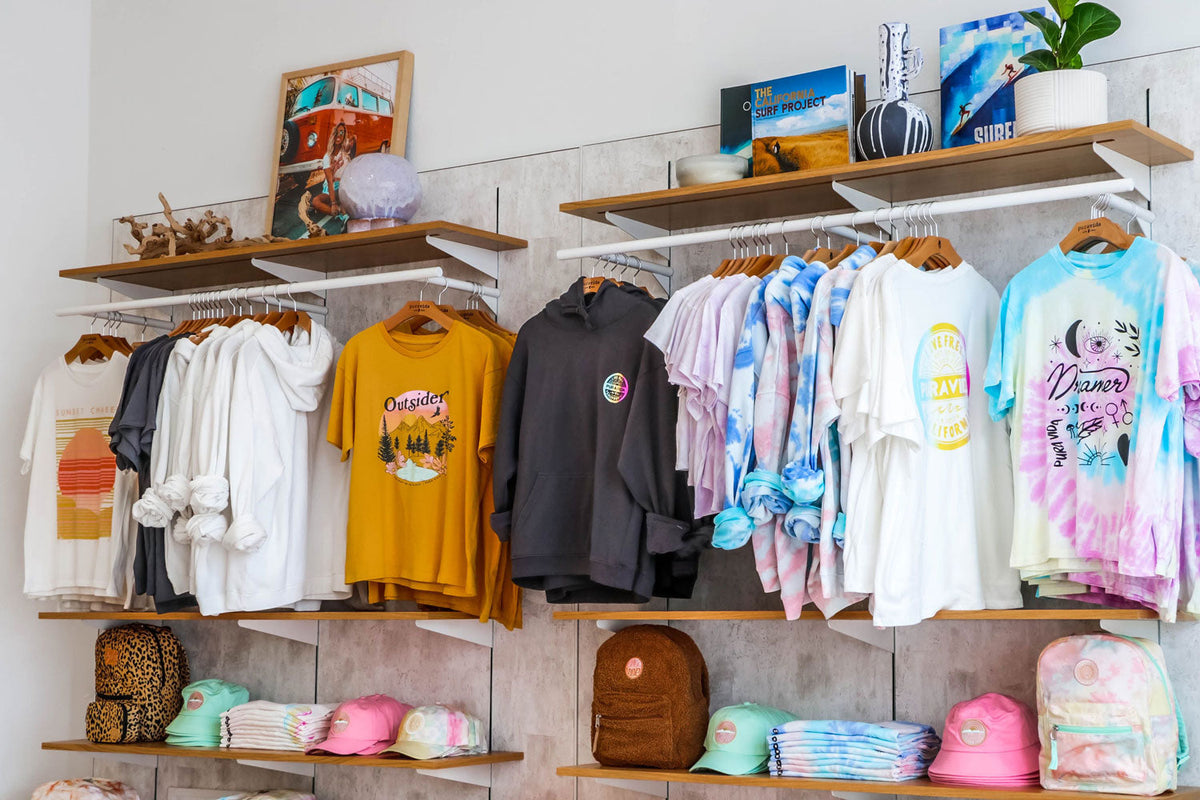 Pura Vida apparel on hangers